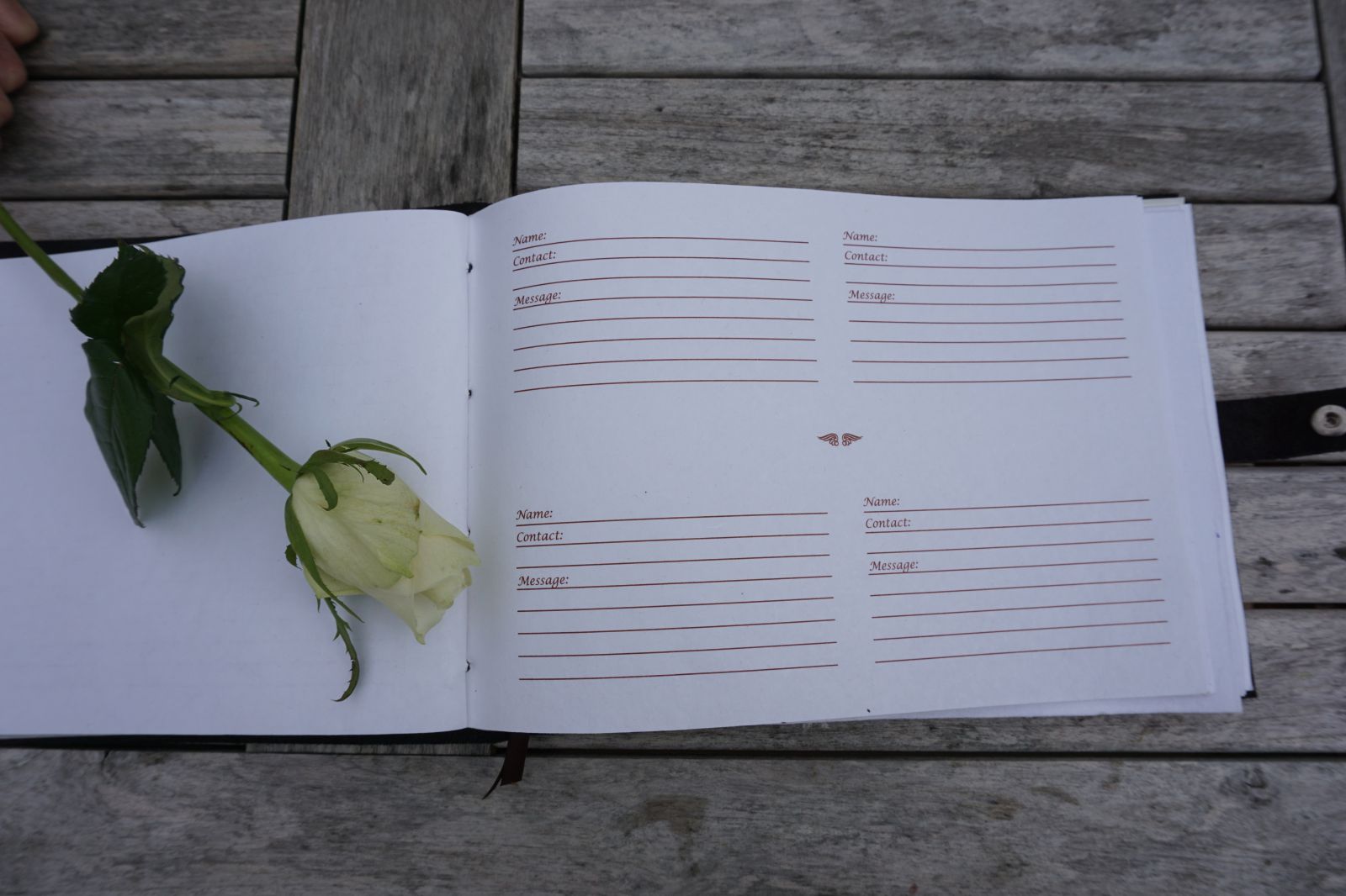 Guestbook pages with floral emboss detail